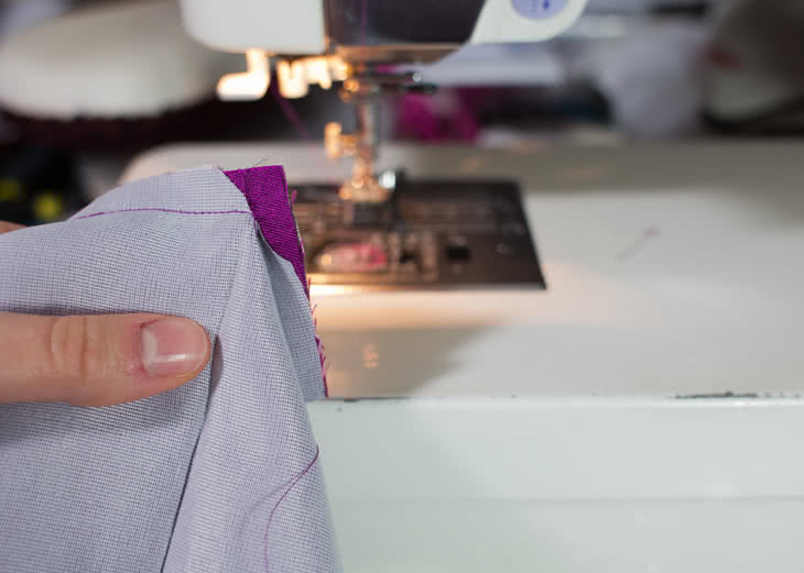 Now sew that edge in place. To make things easier when you have to insert the lining, make sure you stop 3/8? before the end of the bottom layer (this is marked with a notch on the pattern). You'll end up with this when you're done. 