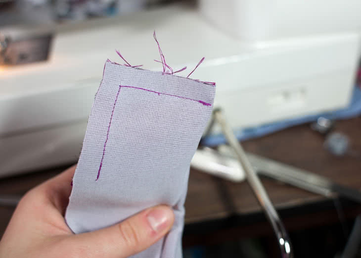 Now sew that edge in place. To make things easier when you have to insert the lining, make sure you stop 3/8? before the end of the bottom layer (this is marked with a notch on the pattern). You'll end up with this when you're done. 