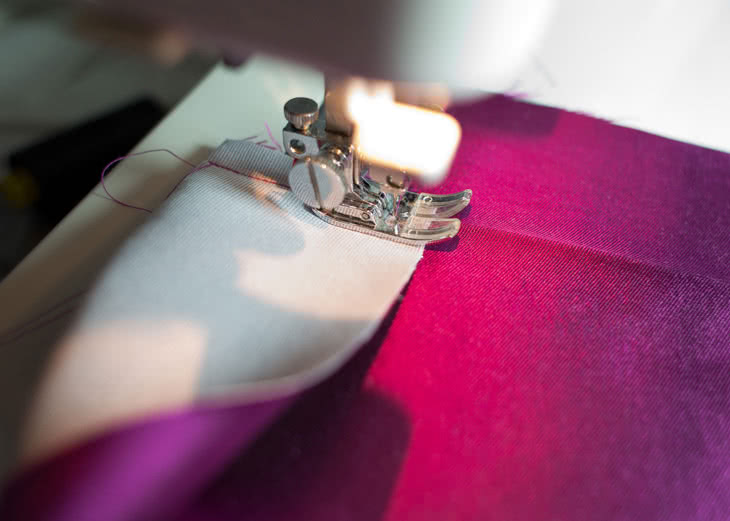 Begin sewing, starting from the foldline of the long folded edge. 