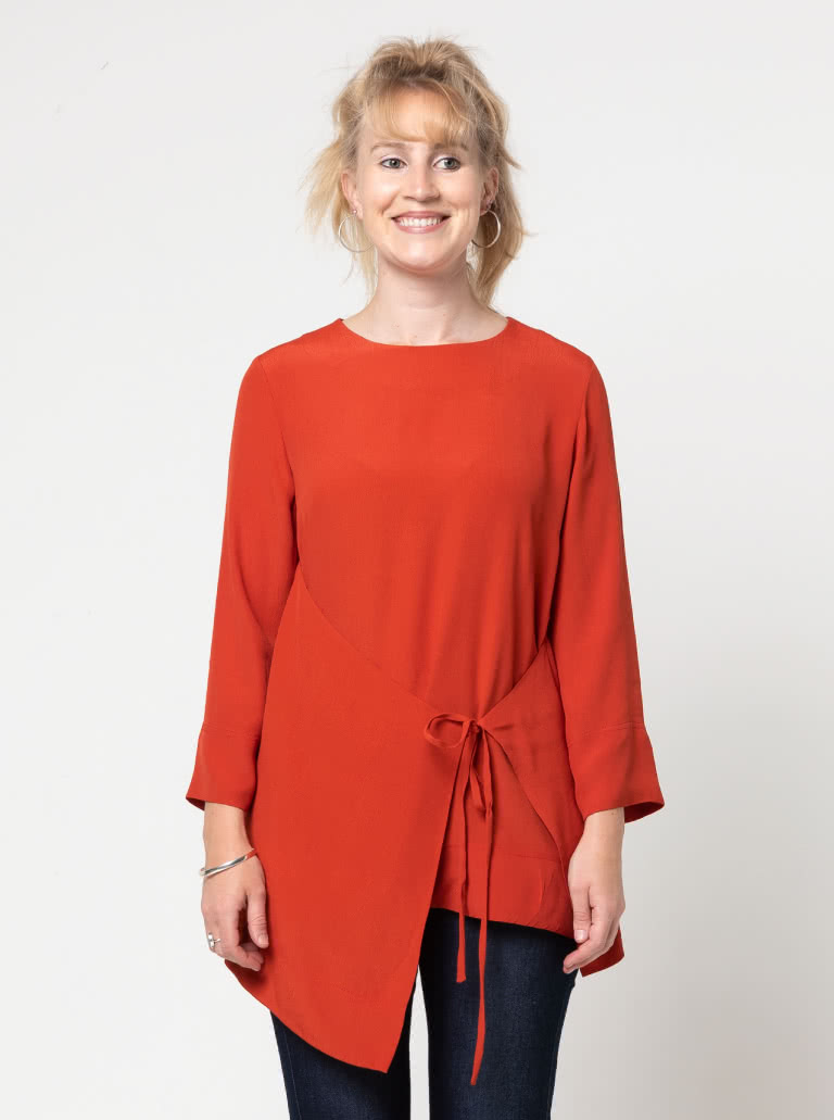 Bessie Woven Tunic By Style Arc - Woven long line top featuring a fashionable tied front over lay and 7/8th length sleeves.