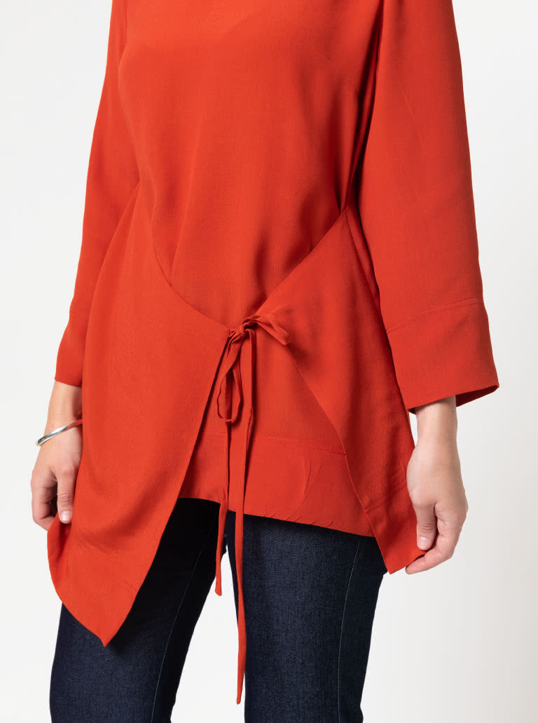 Bessie Woven Tunic By Style Arc - Woven long line top featuring a fashionable tied front over lay and 7/8th length sleeves.