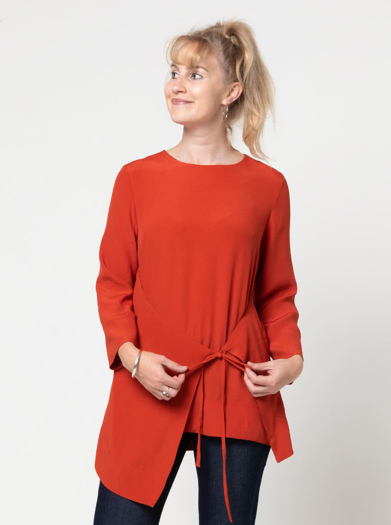 Bessie Woven Tunic By Style Arc - Woven long line top featuring a fashionable tied front over lay and 7/8th length sleeves.