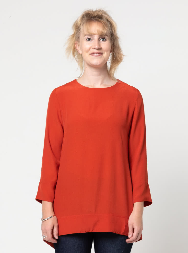 Bessie Woven Tunic By Style Arc - Woven long line top featuring a fashionable tied front over lay and 7/8th length sleeves.