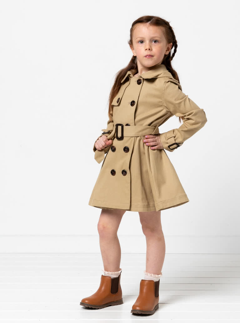 Camille Kids Trench By Style Arc - Option 1. Double breasted Trench coat with gathered skirt, belt and hood for kids 2-14. Option 2. Double breasted Trench coat straight through body, belt and hood for kids 2-14