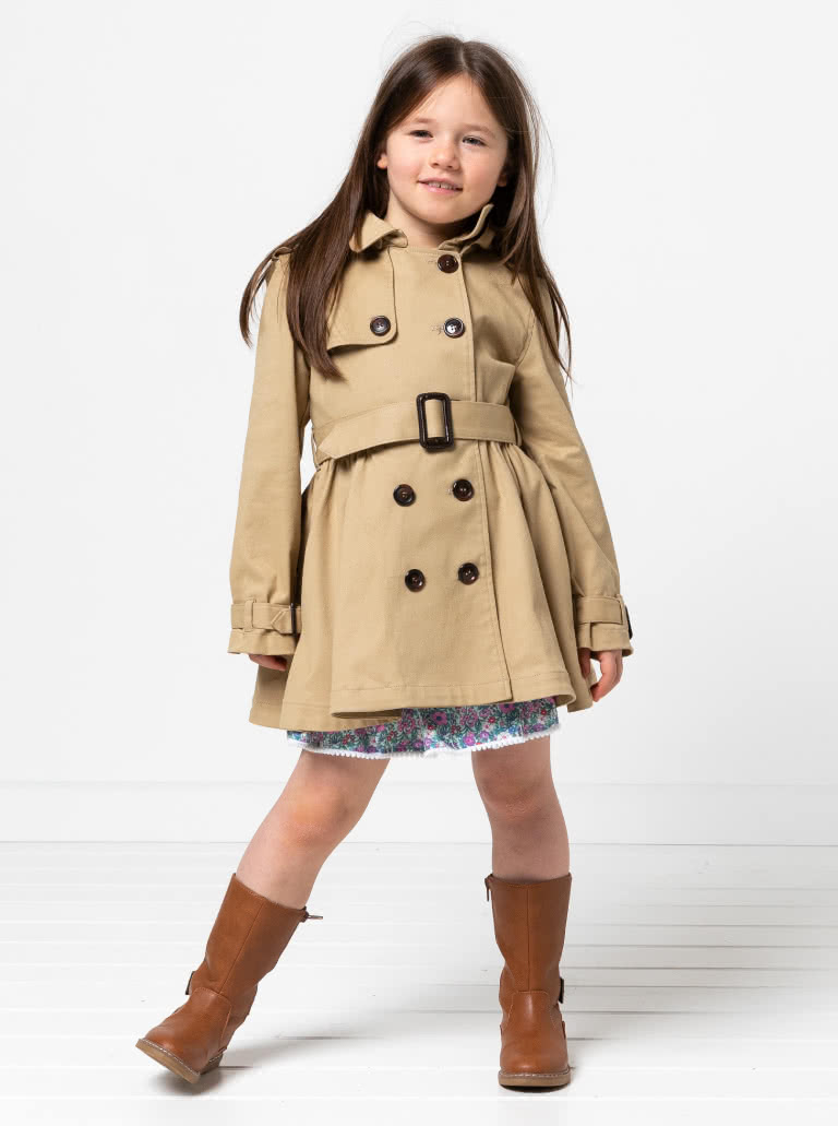 Camille Kids Trench By Style Arc - Option 1. Double breasted Trench coat with gathered skirt, belt and hood for kids 2-14. Option 2. Double breasted Trench coat straight through body, belt and hood for kids 2-14