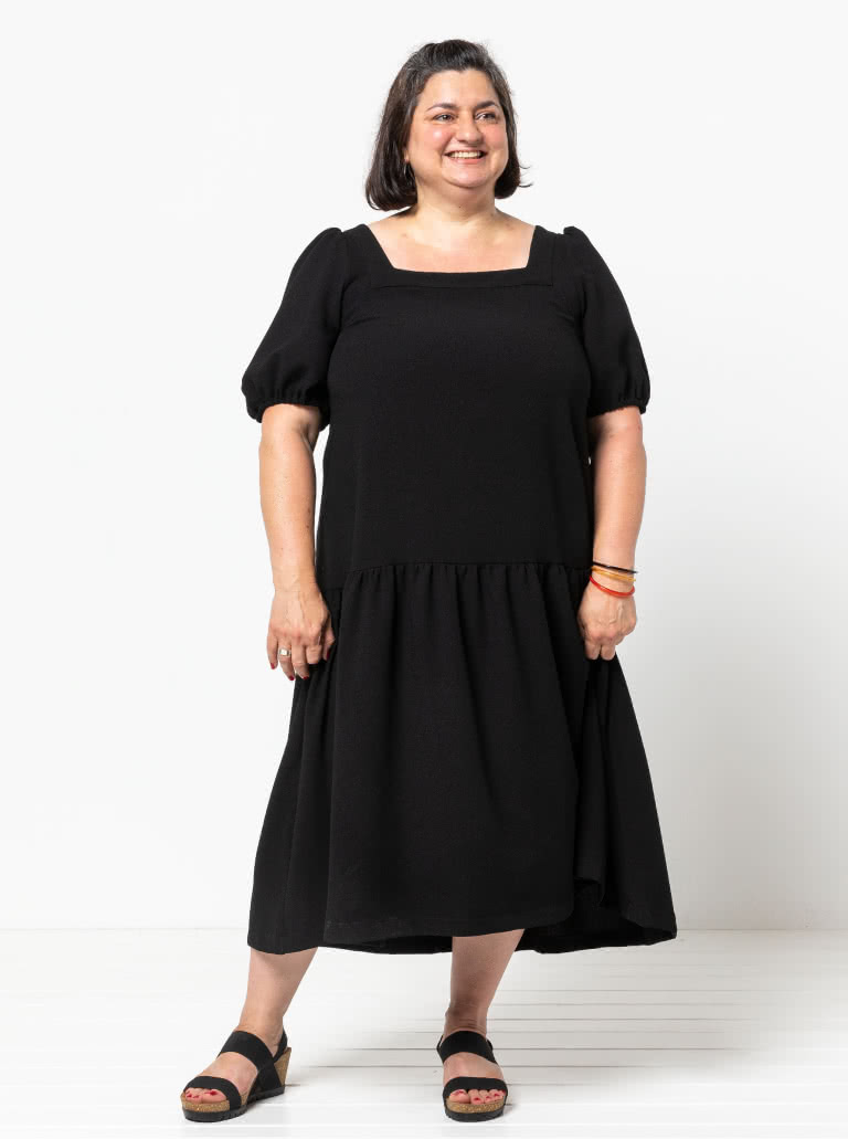 Clementine Woven Top And Dress By Style Arc - Top: A-line top featuring a square neck and puffed elbow length sleeves. Dress: Calf length dress with one gathered lower tier.