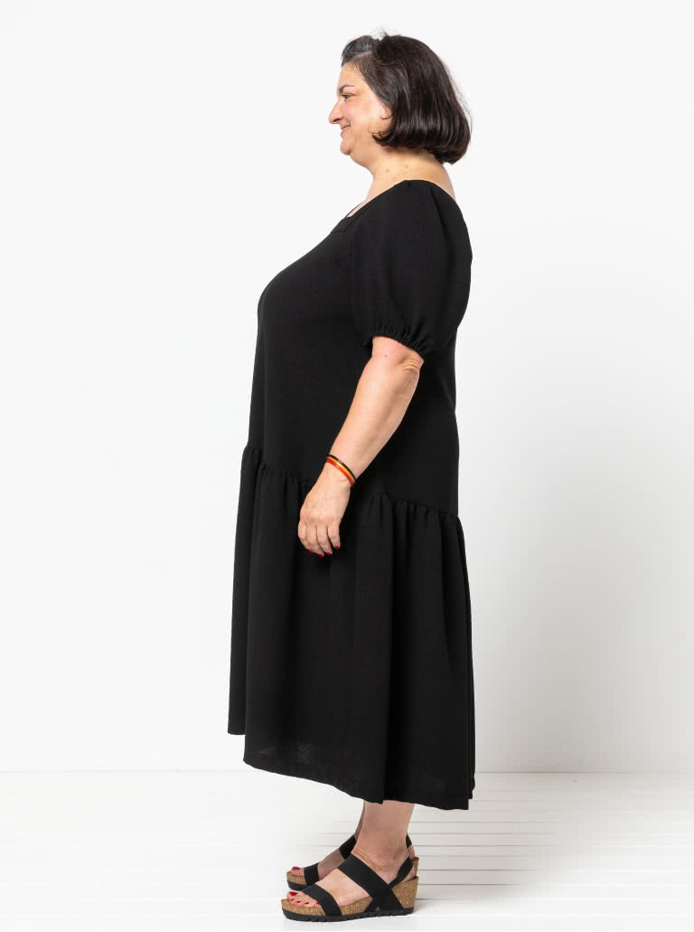 Clementine Woven Top And Dress By Style Arc - Top: A-line top featuring a square neck and puffed elbow length sleeves. Dress: Calf length dress with one gathered lower tier.