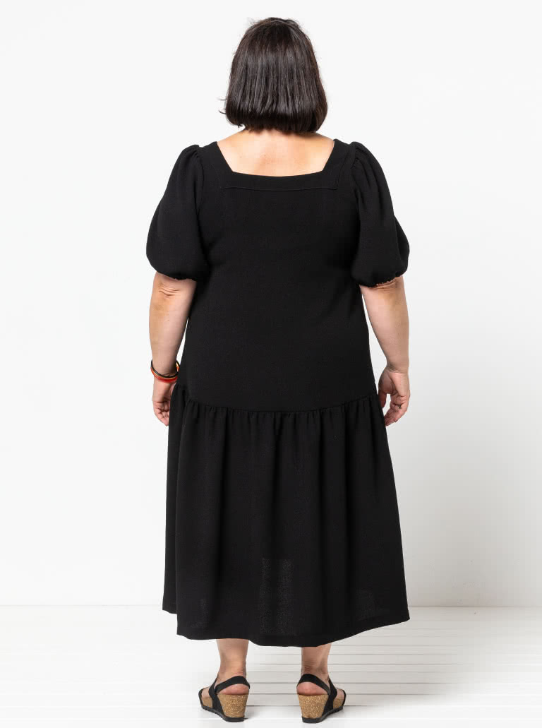 Clementine Woven Top And Dress By Style Arc - Top: A-line top featuring a square neck and puffed elbow length sleeves. Dress: Calf length dress with one gathered lower tier.