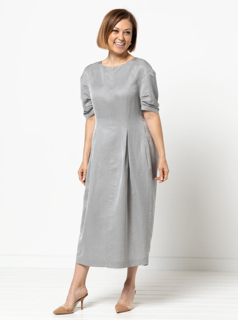 Gertrude Designer Dress By Style Arc - This is a designer dress featuring a fitted bodice, dropped shoulder line, tucked sleeves, inverted pleats and a back zip.