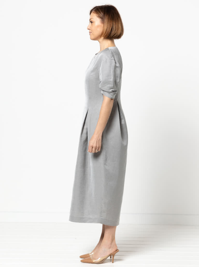 Gertrude Designer Dress By Style Arc - This is a designer dress featuring a fitted bodice, dropped shoulder line, tucked sleeves, inverted pleats and a back zip.