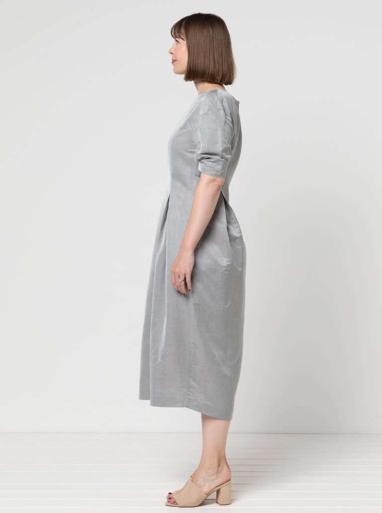 Gertrude Designer Dress By Style Arc - This is a designer dress featuring a fitted bodice, dropped shoulder line, tucked sleeves, inverted pleats and a back zip.