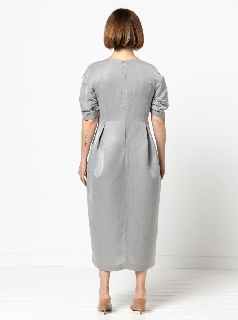 Gertrude Designer Dress By Style Arc - This is a designer dress featuring a fitted bodice, dropped shoulder line, tucked sleeves, inverted pleats and a back zip.