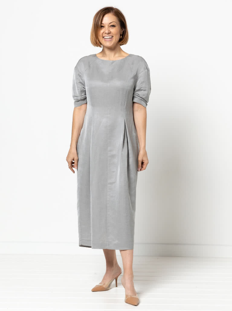 Gertrude Designer Dress By Style Arc - This is a designer dress featuring a fitted bodice, dropped shoulder line, tucked sleeves, inverted pleats and a back zip.