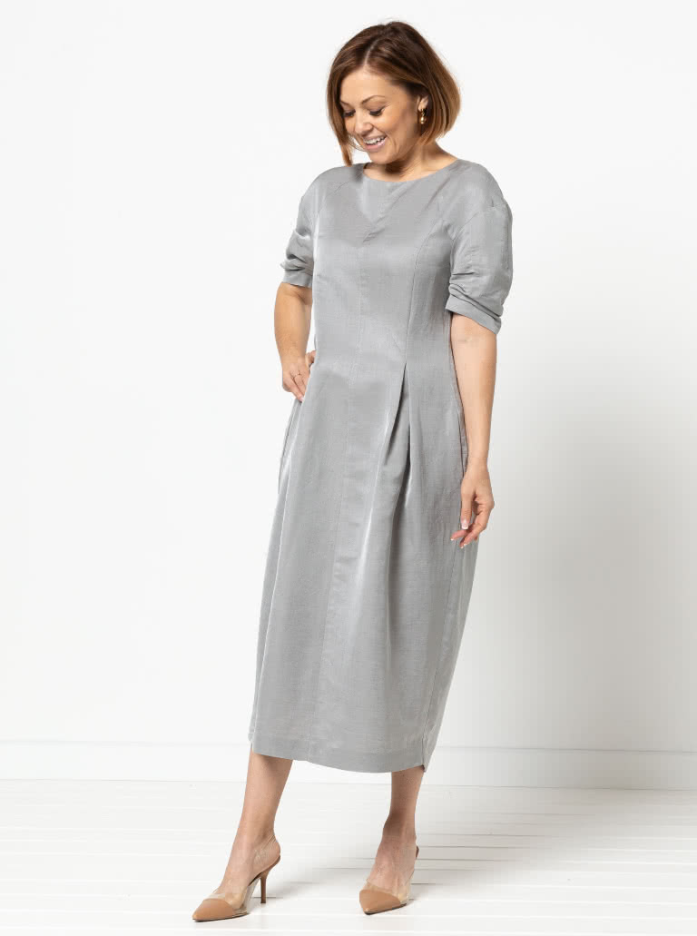 Gertrude Designer Dress By Style Arc - This is a designer dress featuring a fitted bodice, dropped shoulder line, tucked sleeves, inverted pleats and a back zip.