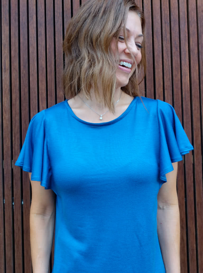Posie Knit Top By Style Arc - Knit top featuring sleeve flounces, round neck and side panels.