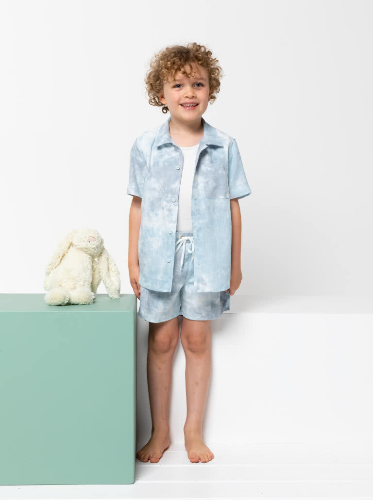 Rhys Overshirt and Bondi Short Kids Bundle By Style Arc - In this fabulous discounted pattern bundle you will receive our Rhys Overshirt with a button front opening, short sleeve and collared shirt, paired with our Bondi Boardie, an elastic waist short with faux fly and option cord ties for kids 2-8