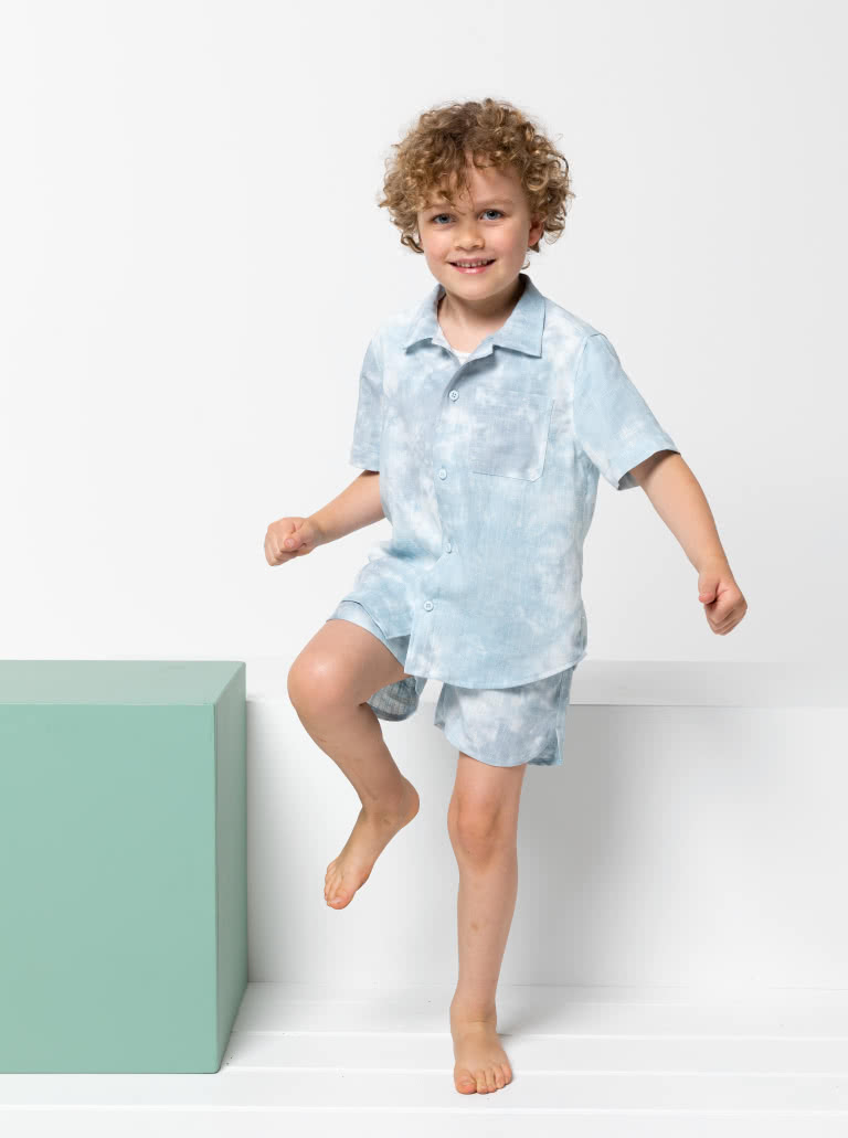 Rhys Overshirt and Bondi Short Kids Bundle By Style Arc - In this fabulous discounted pattern bundle you will receive our Rhys Overshirt with a button front opening, short sleeve and collared shirt, paired with our Bondi Boardie, an elastic waist short with faux fly and option cord ties for kids 2-8