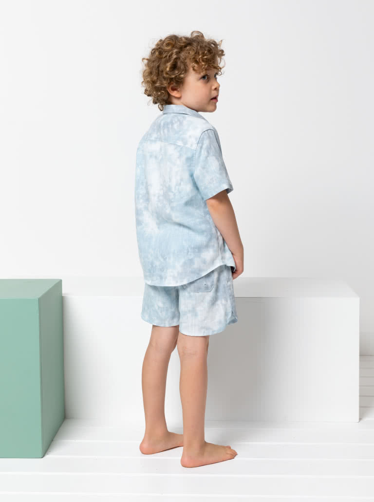 Rhys Overshirt and Bondi Short Kids Bundle By Style Arc - In this fabulous discounted pattern bundle you will receive our Rhys Overshirt with a button front opening, short sleeve and collared shirt, paired with our Bondi Boardie, an elastic waist short with faux fly and option cord ties for kids 2-8